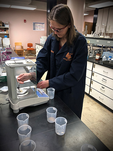 CAMP chemist Tina Stefanescu, conducting acid solubility testing of fracking sand (proppant) expressed as percent of undesirable (non-silica) contaminants.