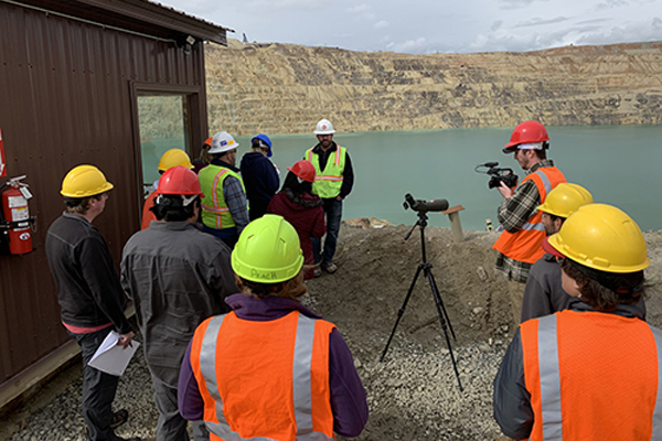 Group of researchers around the Berkley Pit in Butte, MT