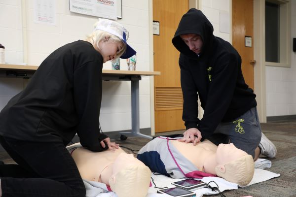 Students peform CPR
