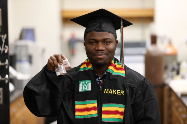 ! Isaac Joseph Cobbinah in his cap and gown in the lab