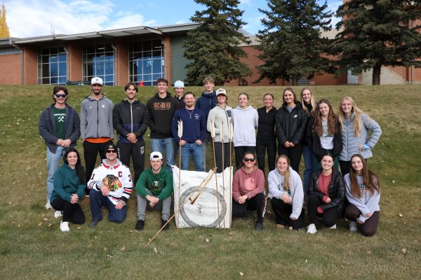 A group photo of students and a target