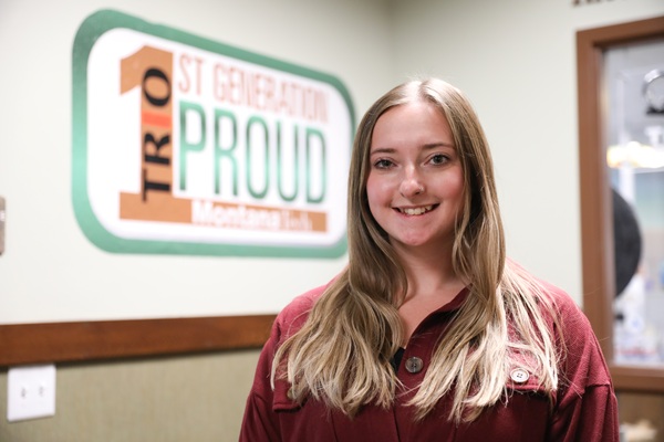 !Paige in front of TRIO sign