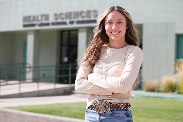 !Kally Strohm in front of Health Sciences building