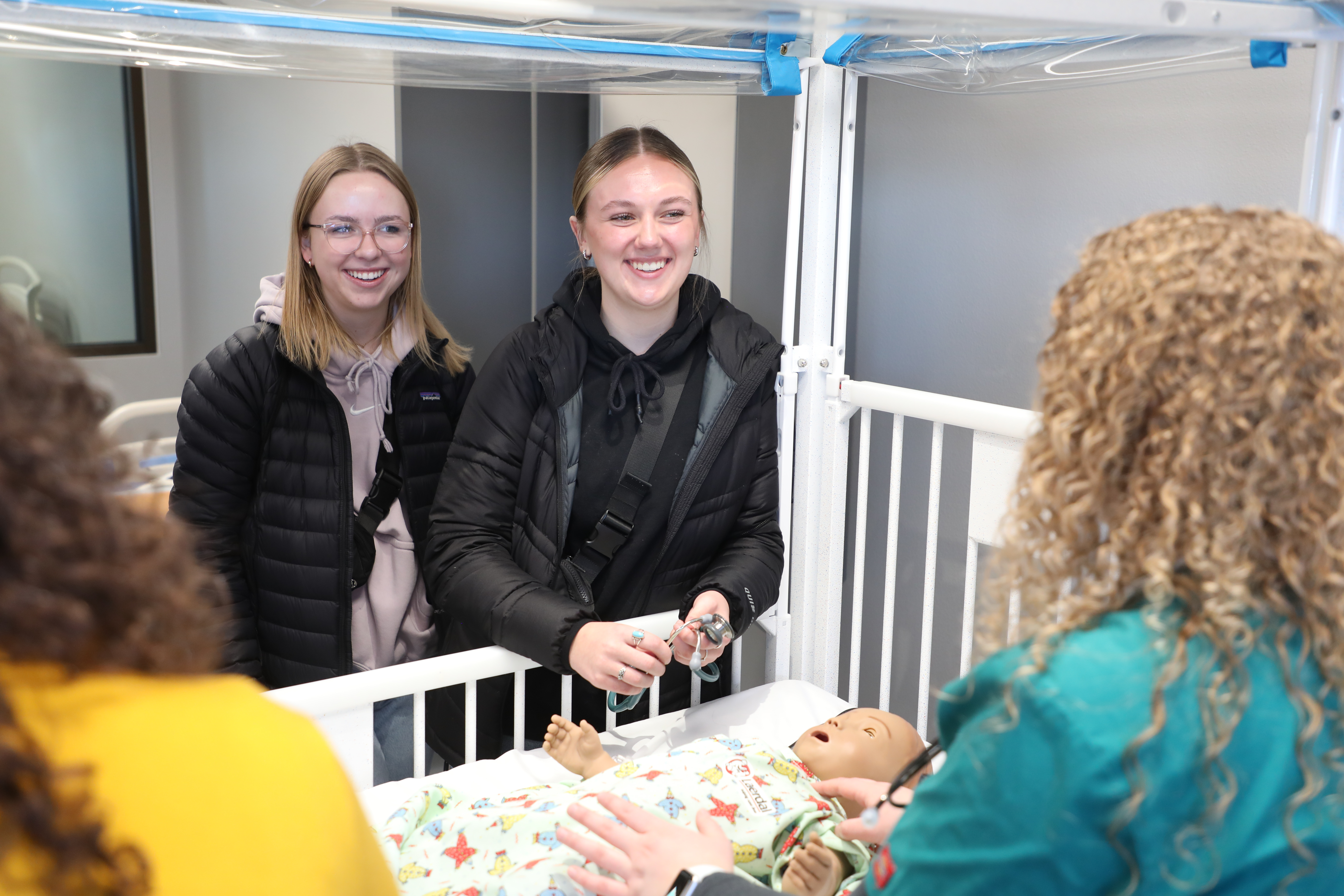 Students attend a nursing simulation.