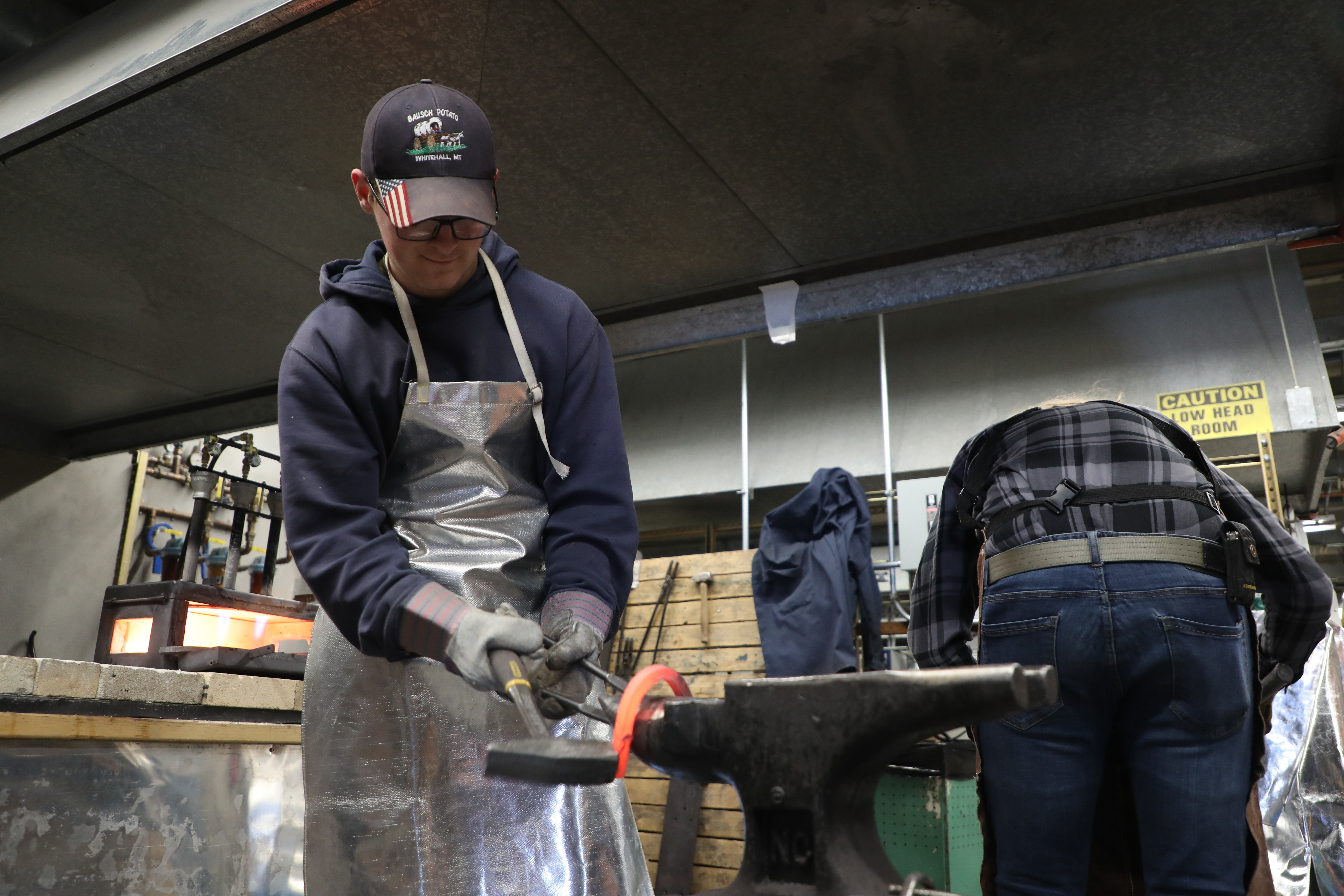 Students attend a metallurgy demonstration.