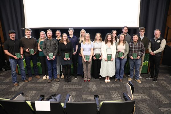 !A group of students with their awards and Chancellor Johnny MacLean