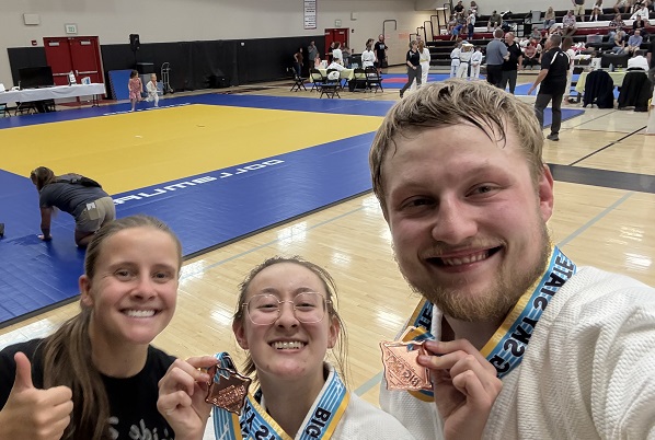 Devin Amtmann, Jade Uriarte, and Gavin Rahl pose for a photo at the Big Sky State Games